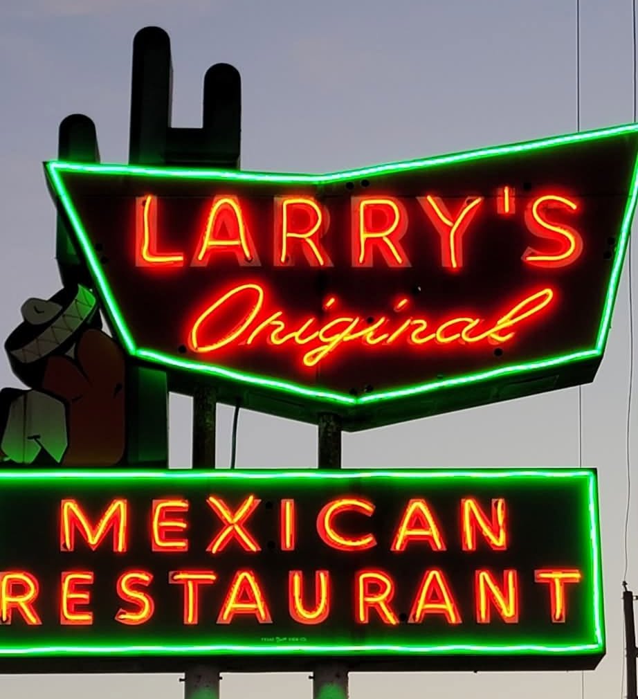 The red and green neon sign at Larry's Original Mexican Restaurant at dusk