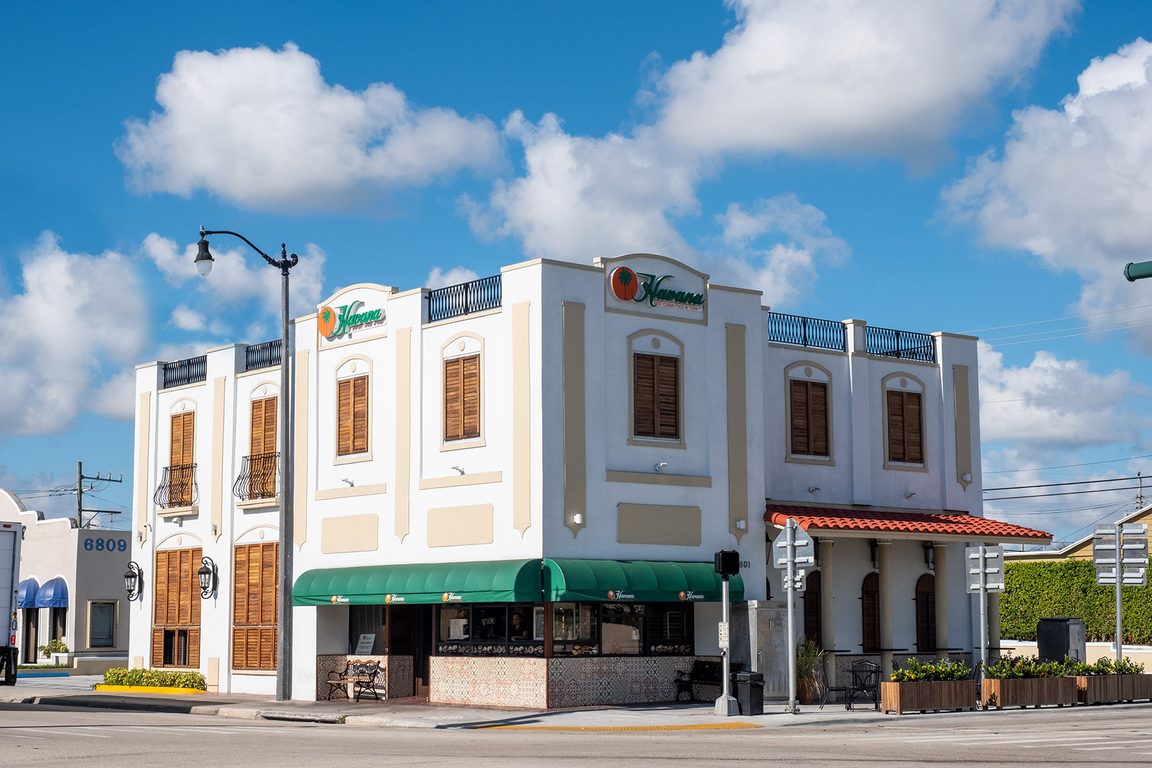 The cream two-story Havana restaurant building with its green awning